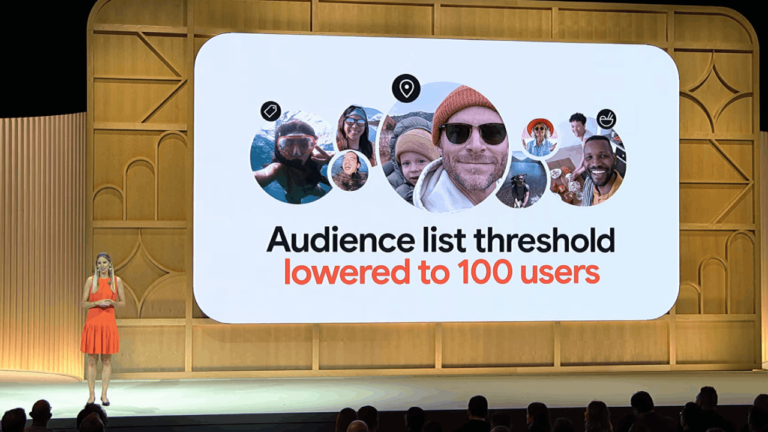 A presenter in an orange dress stands on stage at GML 2024, in front of a large screen displaying a graphic with people's photos. The text reads, "Audience list threshold lowered to 100 users," emphasizing the power of reduced thresholds for Lookalike Audiences.
