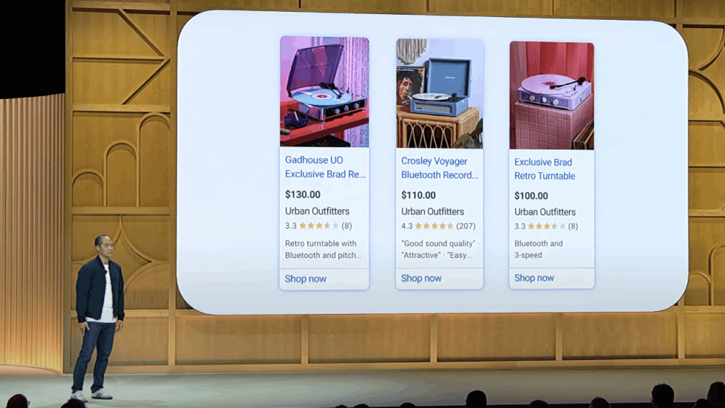 A person stands next to a large screen showcasing Shopping Ads for retro turntables from Urban Outfitters, complete with prices, ratings, and "Shop now" buttons. The listings highlight new features set to debut at GML 2024.