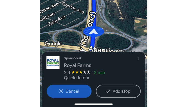A GPS navigation screen on Google Maps displays a route along Atlantic City Road with a blue arrow. A Navigational Ad for Royal Farms, rated 2.9 stars, suggests a 2-minute quick detour. Options to "Cancel" or "Add stop" are available at the bottom of the screen.