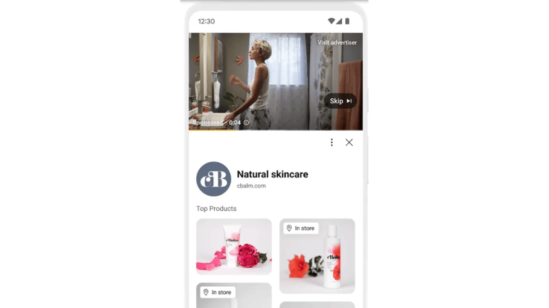 A smartphone screen displays a retail video ad featuring a person in a bathroom. Below, the "Natural Skincare" brand advert showcases images of skincare products, including bottles and flowers, highlighting local availability for eager shoppers.