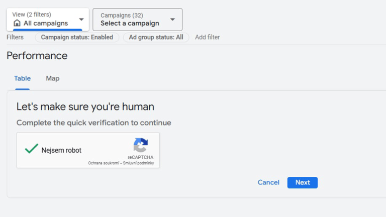 A web page presents a Captcha test with the message "Let's make sure you're human." The checkbox for "I am not a robot" is checked, and the interface features "Cancel" and "Next" buttons below.