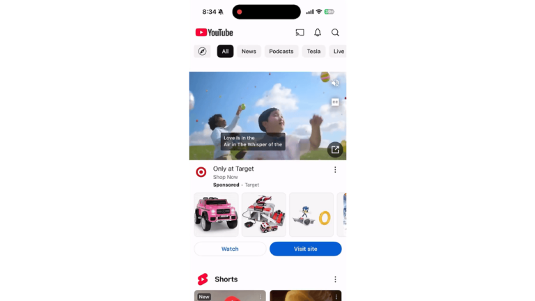 The mobile YouTube app screenshot features a video thumbnail of children playing outside. At the top, menu icons such as All, News, and Podcasts enhance engagement. A mid-screen toy ad from Target leverages Discovery Ads. The bottom displays Shorts and more menu options.