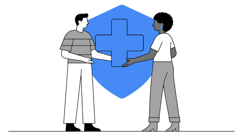 Illustration of two people shaking hands in front of a large blue shield with a medical cross, symbolizing healthcare partnership, medical insurance, or healthcare professional targeting in line with Google ads policy.