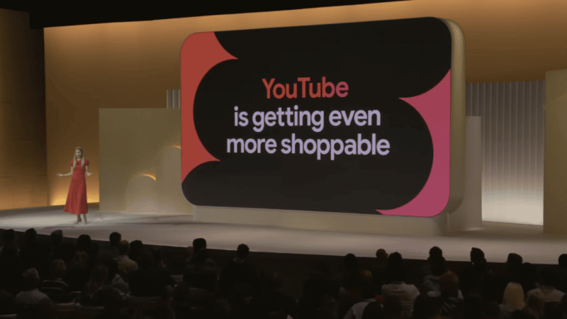 A woman in a red dress stands on stage presenting to an audience. Behind her, a large screen reads, “YouTube is getting even more shoppable,” highlighting new YouTube shoppable ads at GML 2025.