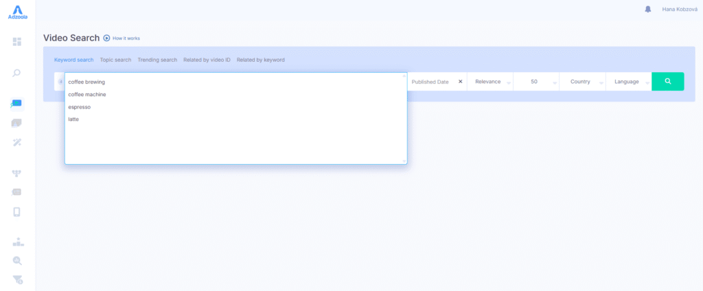A video search page powered by Adzoola with a search bar displaying suggestions like "coffee brewing," "coffee machine," "espresso," and "latte." Filters for published date, relevance, country, and language help drive results efficiently.