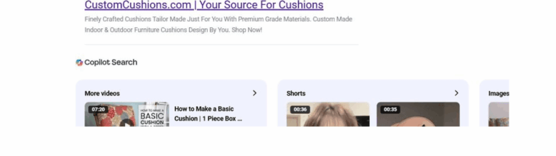 A Google search results page displays a Search Ads label on an ad for "CustomCushions.com | Your Source For Cushions," highlighted by a red arrow. Various shopping links and product listings appear above the ad.