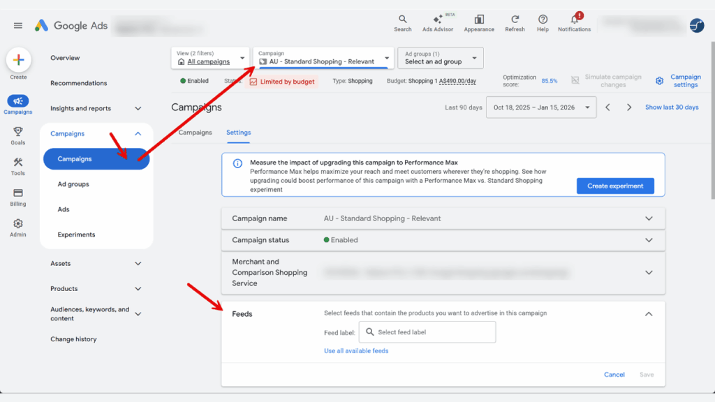 Google Ads campaign settings page with the "Campaigns" menu selected and an arrow highlighting the "Feeds" section, where a product feed URL is displayed for configuring Shopping Ads through the Merchant API.