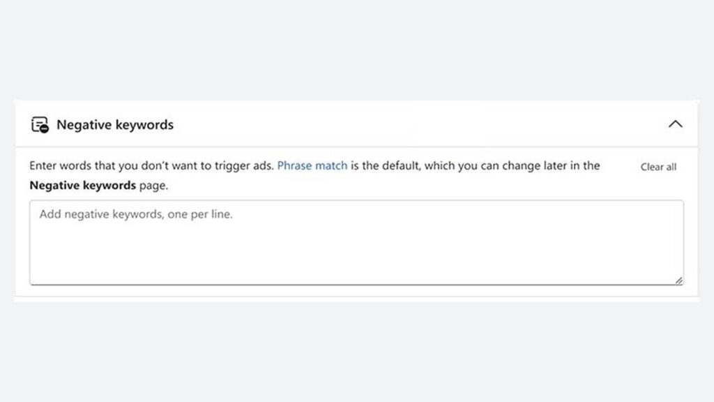 Screenshot of an online ad platform, similar to Microsoft’s self serve negative keywords tool, showing a "Negative keywords" section. There's a text box to add keywords—one per line—with phrase match set as the default.