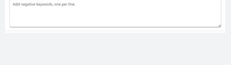 Screenshot of an online ad platform, similar to Microsoft’s self serve negative keywords tool, showing a "Negative keywords" section. There's a text box to add keywords—one per line—with phrase match set as the default.