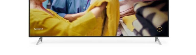 A TV screen displays an older couple laughing together while folding laundry in a bright, colorful room with shelves of towels, as a YouTube CTV VRC Non-Skippable Ad plays in the background.