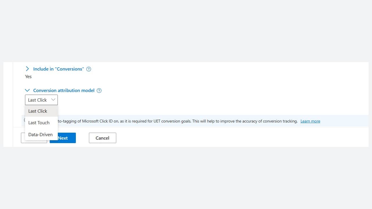 A screenshot of a Microsoft Advertising webpage showing a dropdown menu for selecting a conversion attribution model, with options "Last Click," "Last Touch," and "Data-Driven Attribution" visible. "Include in 'Conversions'" is set to Yes.