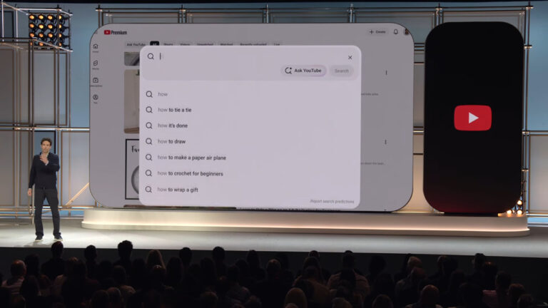 YouTube search suggestions dropdown displayed on large screen during presentation showing how Google Search integrates with YouTube recommendations for digital marketing
