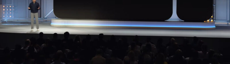 Presenter on stage next to large display showing equation: Attributed Brand Searches plus sign Qualified Future Conversions, illustrating PPC marketing causality concept