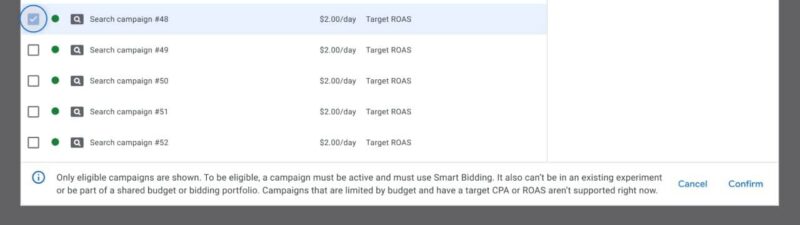 Screenshot of Google Ads budget and bidding target experiment creation interface showing a list of eligible search campaigns with daily budgets and Target ROAS bidding strategy selected for experiment testing.