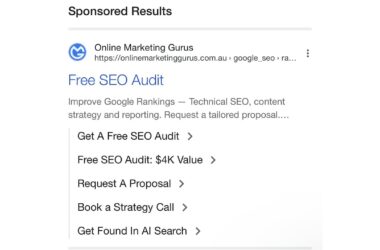 Screenshot of Google sponsored search result showing Online Marketing Gurus free SEO audit ad with multiple sitelink extensions including Get A Free SEO Audit, Free SEO Audit $4K Value, Request A Proposal, Book a Strategy Call, and Get Found In AI Search options.